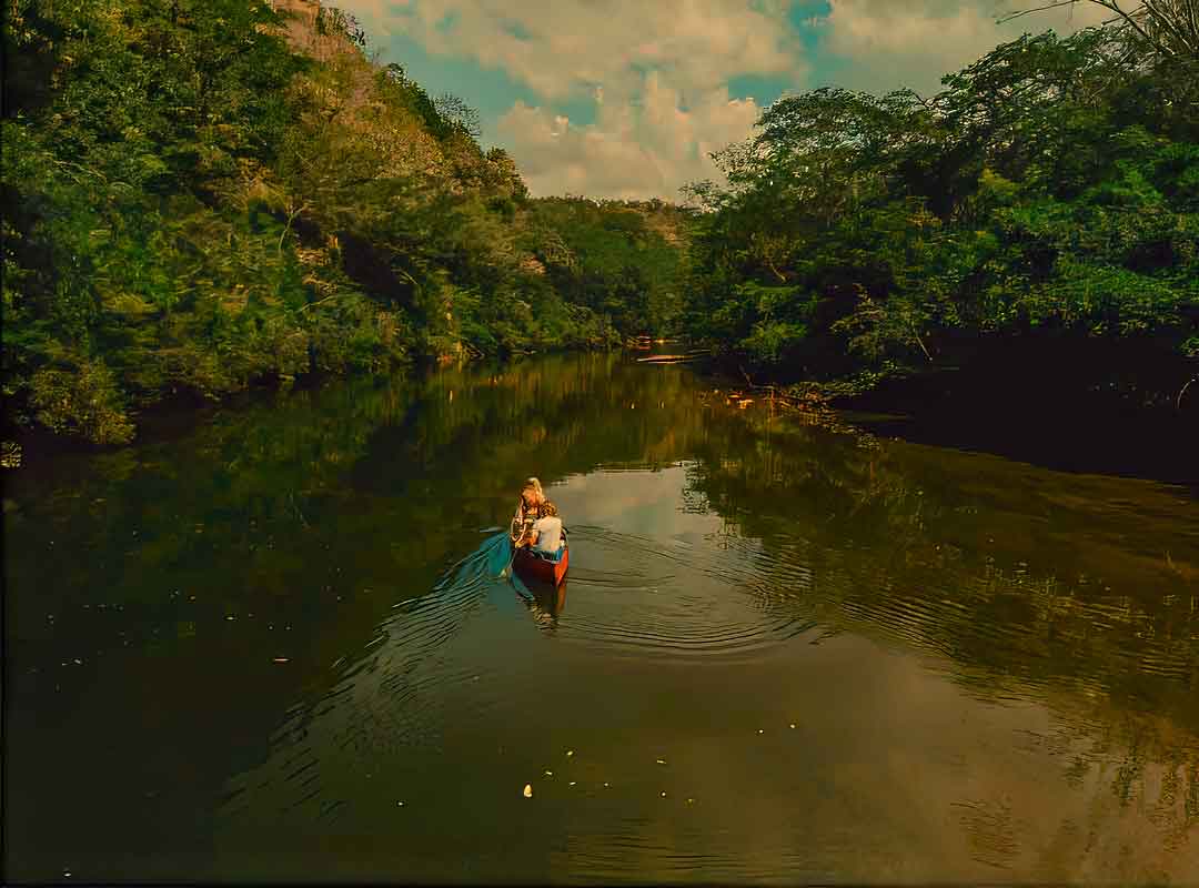 Canoe on the Macal River near San Ignacio, Belize, a peaceful jungle adventure in western Belize